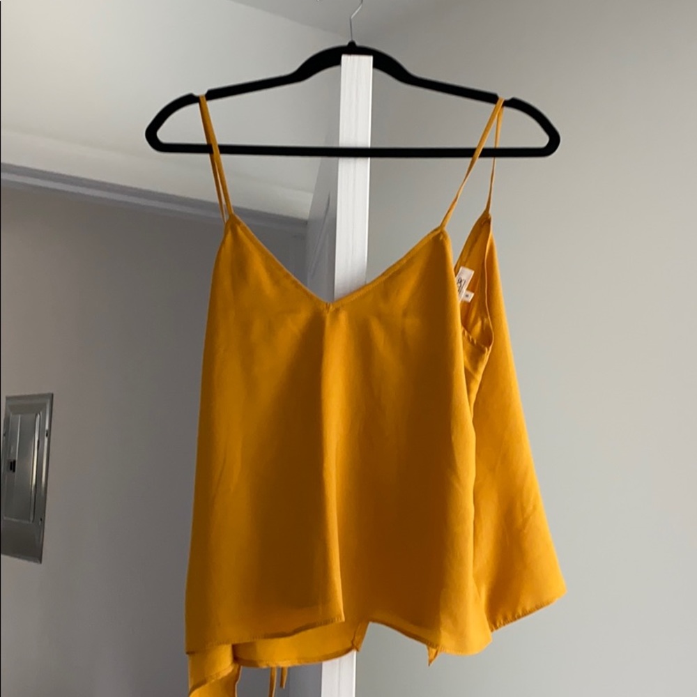 Small yellow wyldr cross back tank. Rarely worn.